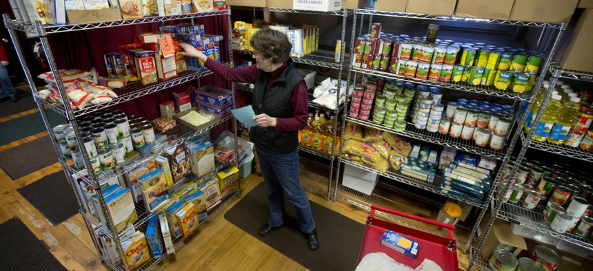 Volunteer Sue Barwig fills an order for a guest at the Interfaith Food Pantry at Emmanuel Baptist Church on Wednesday, Feb. 24, 2016, in Albany, N.Y.