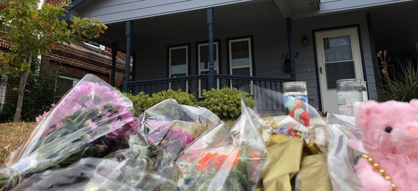 Bouquets of flowers and stuffed animals are piling up outside the Fort Worth home Monday, Oct. 14, 2019, where a 28-year-old black woman was shot to death by a white police officer.
