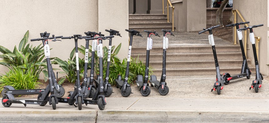 Clusters of scooters sometimes block sidewalk access.