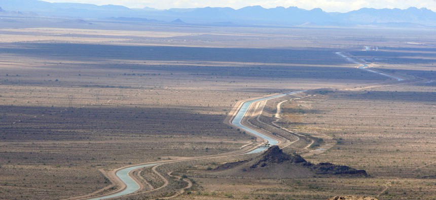 In this 2010 file photo, the Central Arizona Project aqueduct system is shown meandering west out of the Phoenix metro area. The system was once seen as a steadfast source to replenish groundwater in certain areas. A new report suggests that's changing.