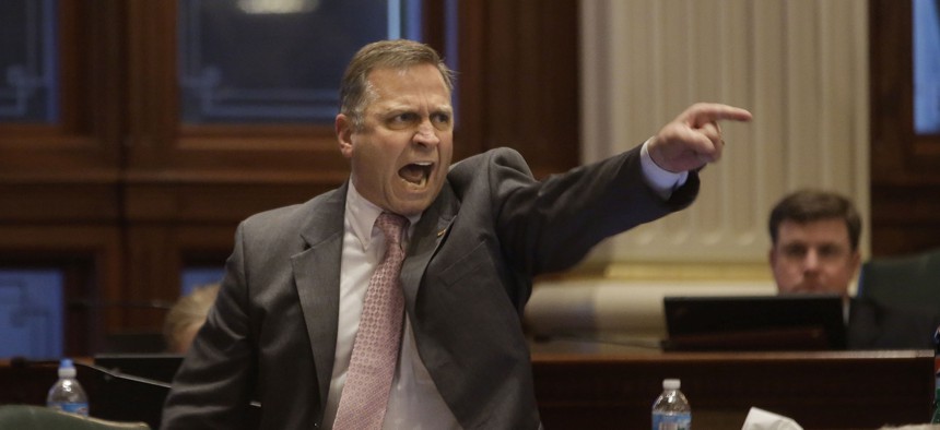 U.S Rep. Mike Bost, formerly a state representative, shouts in a gun debate at the Illinois state legislature in 2013.
