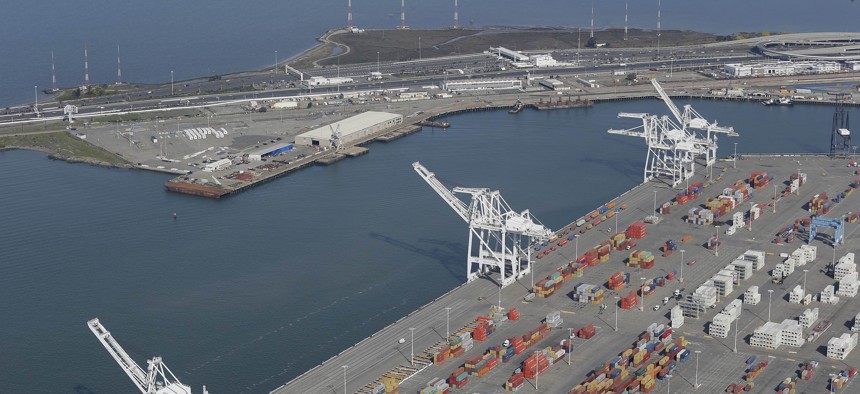 The former Oakland Army Base pier at left and the Port of Oakland at lower right in Oakland, Calif., as seen in February 2016. A developer is seeking to build a bulk cargo terminal that would handle coal and other goods at the former Army base site.
