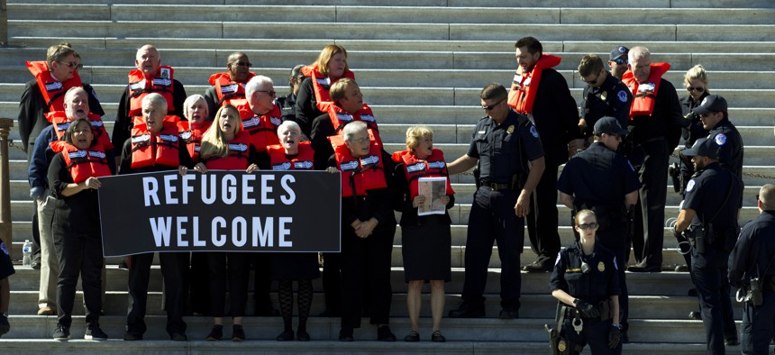 Faith leader were arrested during a protest in support of the refugee resettlement program in Oct. 2019. Faith groups are suing the Trump administration over changes to the refugee resettlement system.