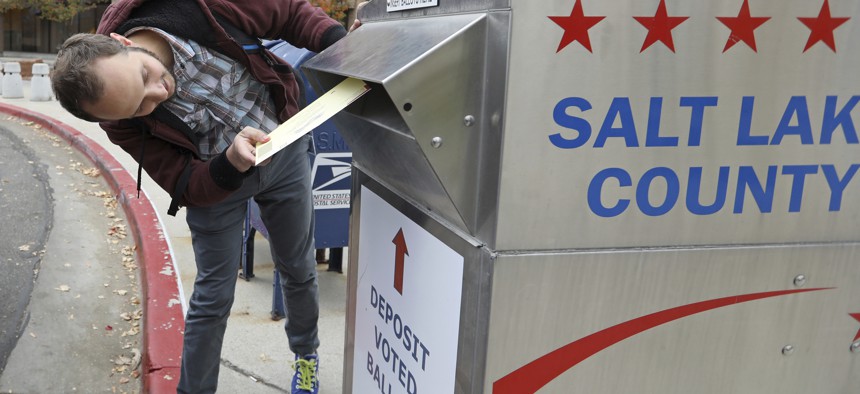 A Salt Lake City voter casts his ballot in the November 2018 elections. While Utah cities can opt into ranked-choice voting, Salt Lake County election officials do not support the system.