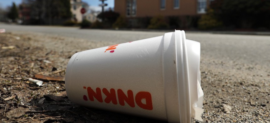 A coffee cup made from polystyrene foam, commonly known as Styrofoam, lies on the side of a road, Wednesday, May 1, 2019, in Augusta, Maine. Lawmakers in the state banned many foam food containers earlier this year. New York could soon follow suit.