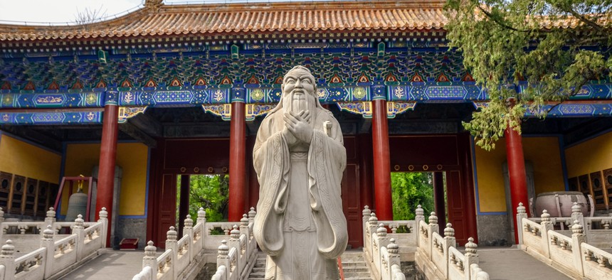 Statue at the entrance of the Temple of Confucius in Beijing, China