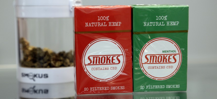 Smokable pre-rolled hemp packs and flower are seen on the counter at the Hemp Farmacy in Raleigh, North Carolina. North Carolina lawmakers have proposed banning the sale of smokable hemp products.