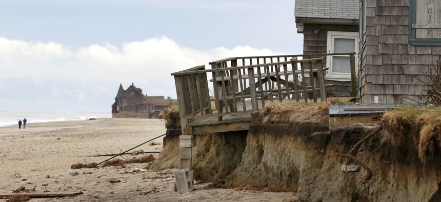In this Tuesday, Nov. 13, 2012 photo, cottages rest near an eroded shoreline on Roy Carpenter's Beach, in South Kingstown, R.I. 