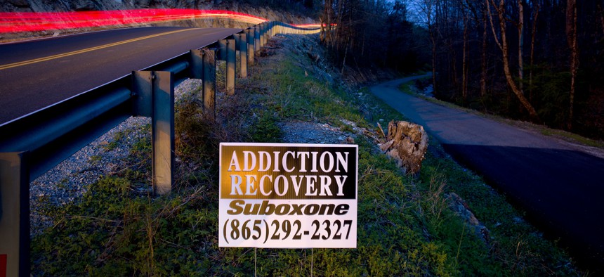 An addiction recovery sign stands beside a road in LaFollette, Tenn., Wednesday, April 11, 2018. In 2015, Campbell County had the third-highest amount of opioids prescribed per person among all U.S. counties, according to the CDC. 