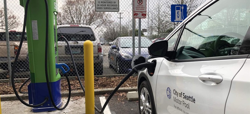 A Seattle City Light vehicle charges at one of the utility’s new electric vehicle charging stations in the city’s SoDo neighborhood.