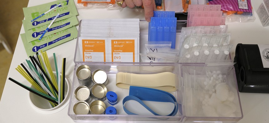 Safe injection supplies like the ones shown here include gauze, needles, tourniquets, and alcohol swabs.