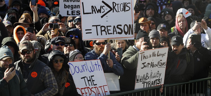 Gun-rights supporters demonstrate in front of the state Capitol in Richmond, Va., Monday, Jan. 20, 2020. 