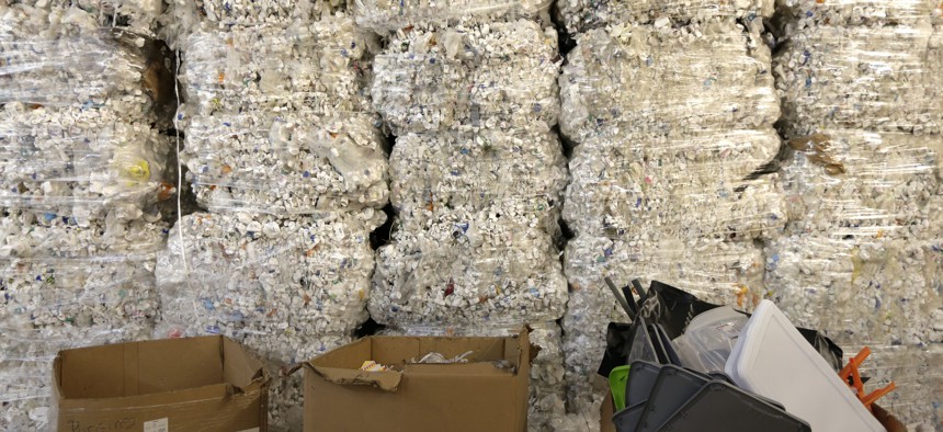 In this May 7, 2019 photo, plastic pill bottles are bundled for recycling at a GDB International warehouse in Monmouth Junction, N.J.