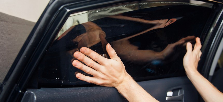 Under current law, car windows must let in at least 70 percent of light.