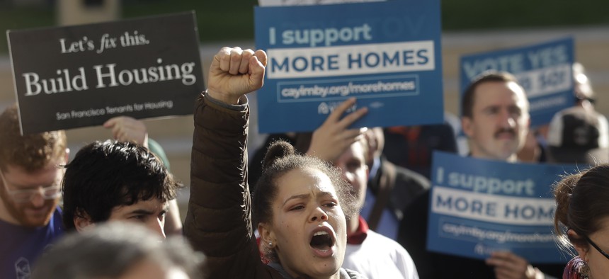 Supporters rally outside City Hall in Oakland, California, in favor of Democratic state Sen. Scott Wiener’s bill that would allow more housing to be built near public transportation.