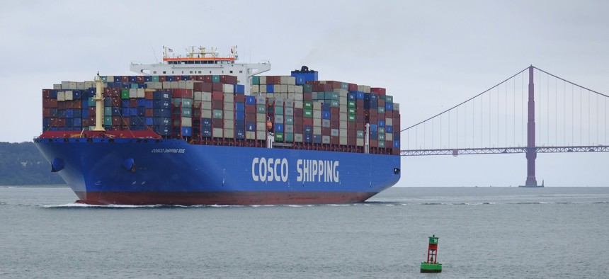 A Cosco Shipping container ship passes the Golden Gate Bridge Tuesday, May 14, 2019, in San Francisco bound for the Port of Oakland.