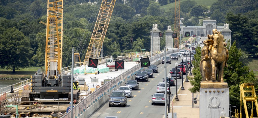 The entrance to Arlington National Cemetary is visible from the Lincoln Memorial as restoration work continues on Memorial Bridge over the Potomac River, Tuesday, July 2, 2019, in Washington.