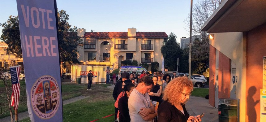 More than 150 people line up to vote near the end of Super Tuesday at the Stoner Recreation Center in West Los Angeles. Some voters throughout the city had to wait more than two hours to vote.