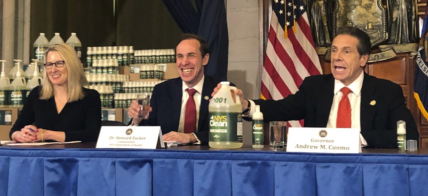 New York Gov. Andrew Cuomo, right, introduces "New York State Clean," a hand sanitizer manufactured by the state on March 9, 2020 in response to the coronavirus. 