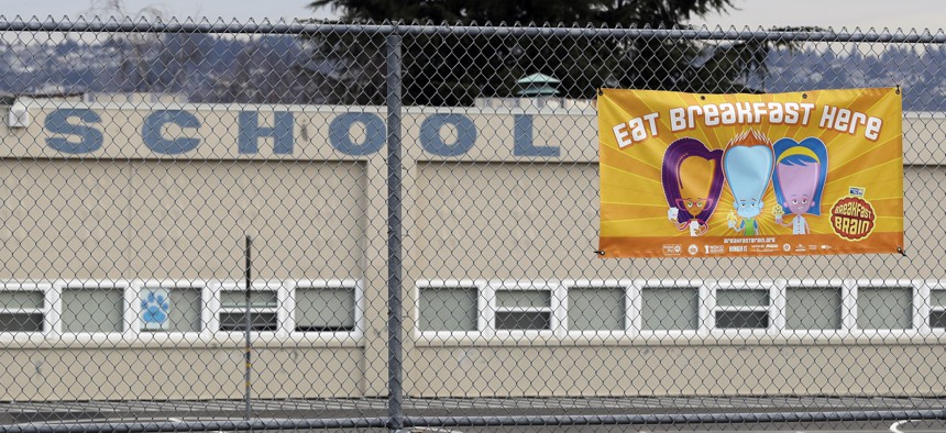 A sign promoting breakfast being served at Lowell Elementary School in Tacoma, Wash., is shown Tuesday, March 10, 2020.