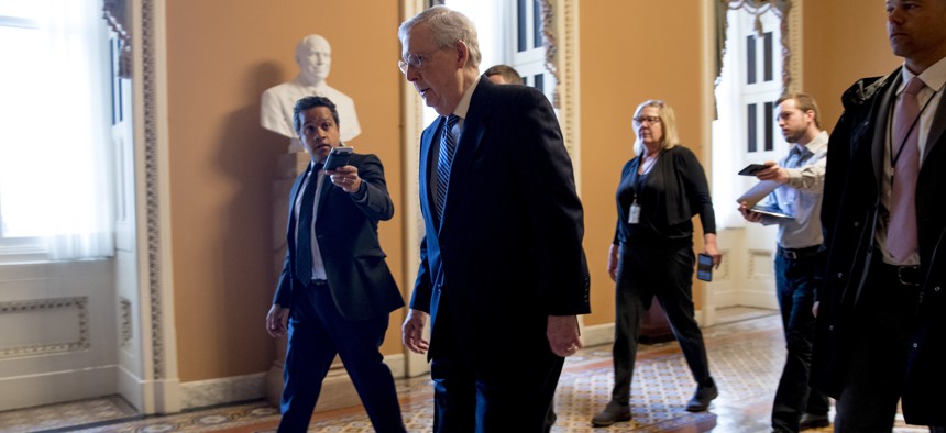 Senate Majority Leader Mitch McConnell of Ky. arrives on Capitol Hill in Washington, Monday, March 23, 2020, as the Senate is working to pass a coronavirus relief bill. 