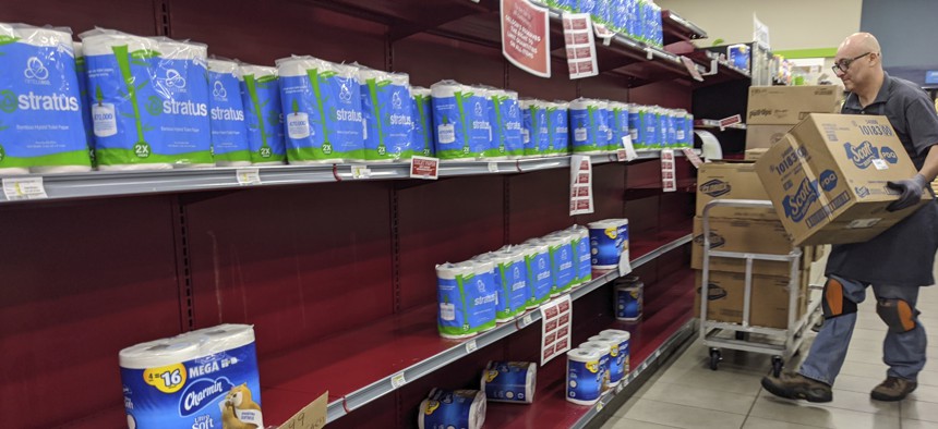 Toilet paper is restocked at the Gelson's Market in Los Feliz neighborhood of Los Angeles on Thursday, March 26, 2020.