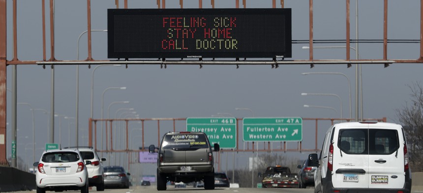 A sign over Interstate 94 in Illinois. Gov. J.B. Pritzker’s statewide stay-at-home order in response to the coronavirus pandemic is in effect through at least April 7.