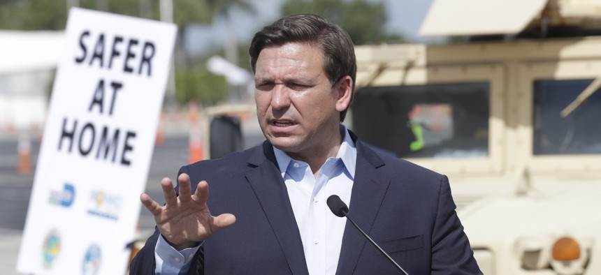 Florida Gov. Ron DeSantis speaks during a news conference at a drive-through coronavirus testing site in front of Hard Rock Stadium, Monday, March 30, 2020, in Miami Gardens, Fla. 