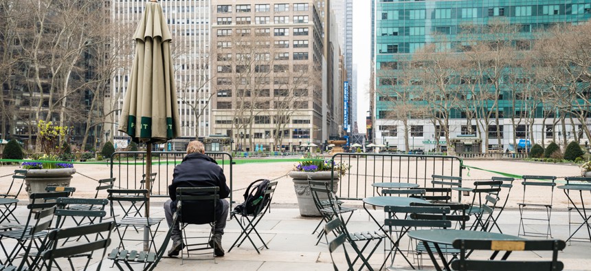 A man sits alone in New York City.