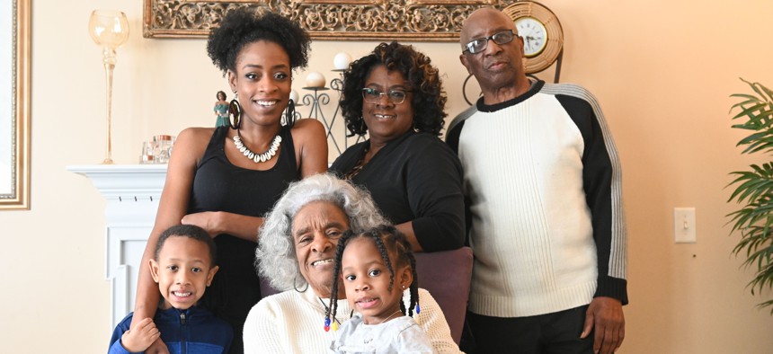 The Walker family ― (standing from left) Michael "Amir" Nimrod, Andre'a Walker-Nimrod, Wilma Walker, Howard Walker, (seated) matriarch Evelyn Whitfield and Maleeya Nimrod―all live together in Florissant, Missouri. 