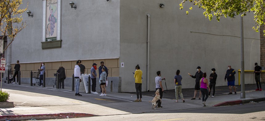 A line wraps around a grocery store in Los Angeles.