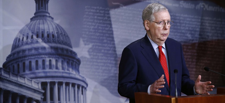 Senate Majority Leader Mitch McConnell of Ky., speaks with reporters after the Senate approved a nearly $500 billion coronavirus aid bill, Tuesday, April 21, 2020, on Capitol Hill in Washington.