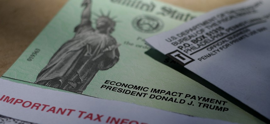 President Donald J.Trump's name is printed on a stimulus check issued by the IRS to help combat the adverse economic effects of the COVID-19 outbreak, Thursday, April 23, 2020, in San Antonio.