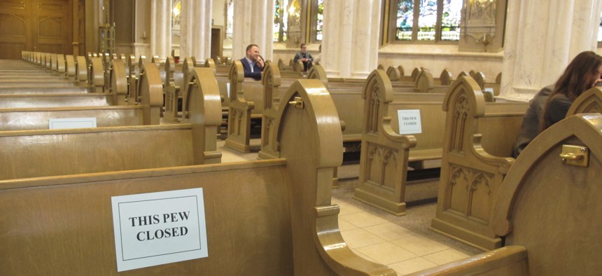 Half of the pews were closed to congregants as services resumed at the Cathedral of St. Helena in Helena, Mont., Sunday, April 26, 2020.