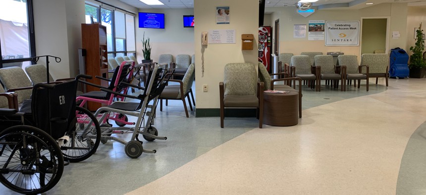A hospital waiting room sits empty. More people are turning to free clinics as they lose health insurance with their jobs.