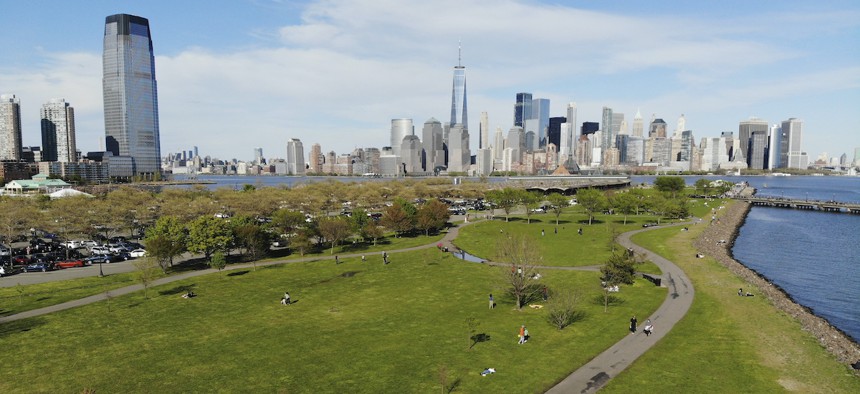 People enjoy the good weather while keeping their distance from one another at Liberty State Park in Jersey City, N.J., Saturday, May 2, 2020. Gov. Phil Murphy said early reports of behavior at the state's newly reopened parks were "so far, so good."