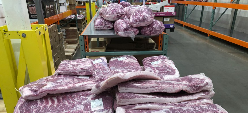 Slabs of beef sit wrapped on a table in a cold room. Across the country, more than 10,000 COVID-19 cases have been linked to meatpacking plants.