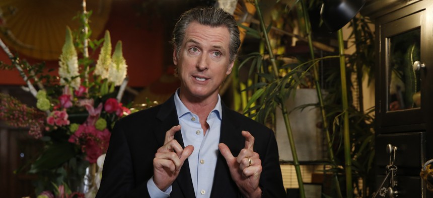 Gov. Gavin Newsom discusses the reopening of businesses during a news conference at Twiggs Floral Design Gallery in Sacramento, Calif. on May 8, 2020. 