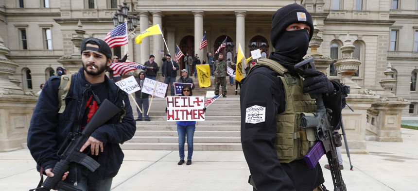 Protesters at the Michigan State Capitol in Lansing. The protests in the state have been organized in part by state militia groups.