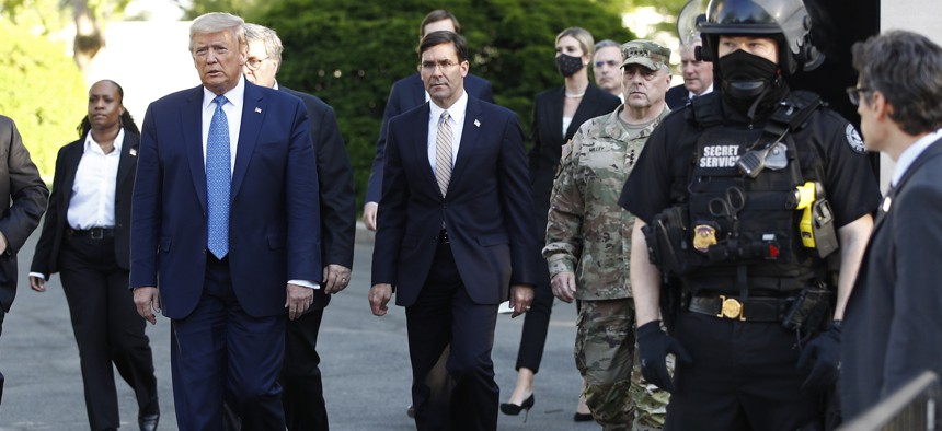 In this June 1, 2020 photo President Donald Trump departs the White House to visit outside St. John's Church in Washington. 