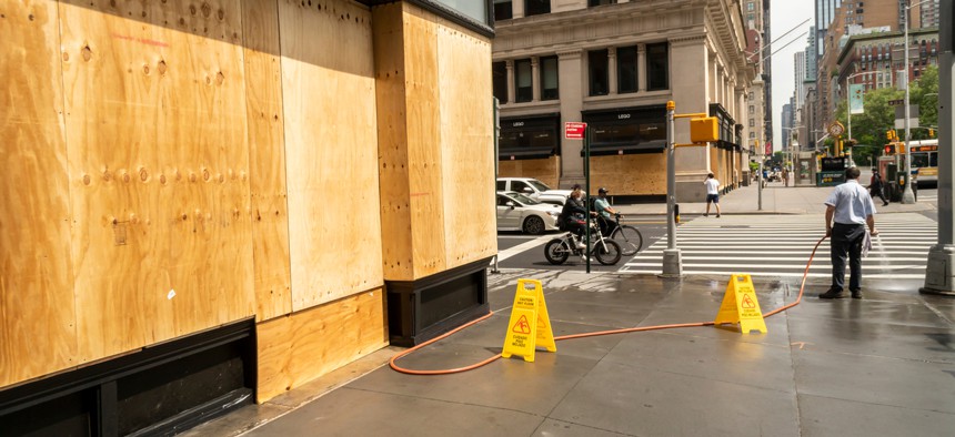 A store in New York City is boarded up.