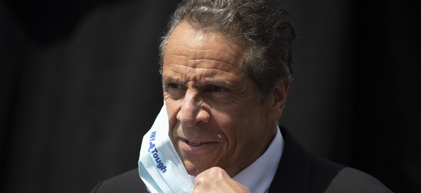 New York Gov. Andrew Cuomo removes a mask during a news conference on June 15, 2020.