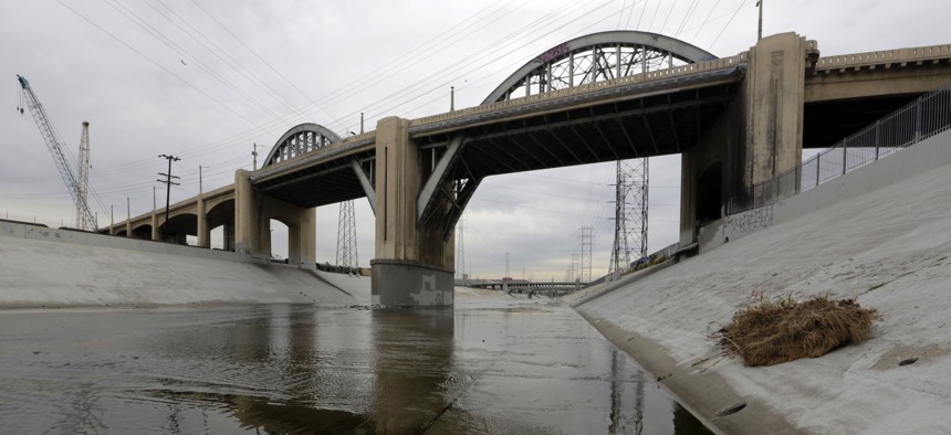 The 6th Street Bridge spans over the Los Angeles River Wednesday, Jan. 27, 2016, in Los Angeles, before it is closed permanently for demolition. The landmark bridge, dating to the 1930s, is being replaced due to deterioration.