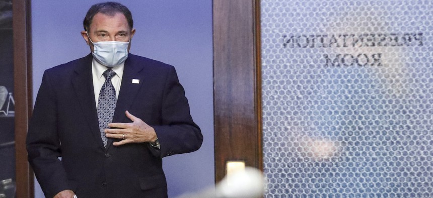 Utah Gov. Gary Herbert wears a mask as he waits in the hallway before the start of the daily briefing on the state's efforts to fight Covid-19 Wednesday, June 24, 2020, in Salt Lake City. 