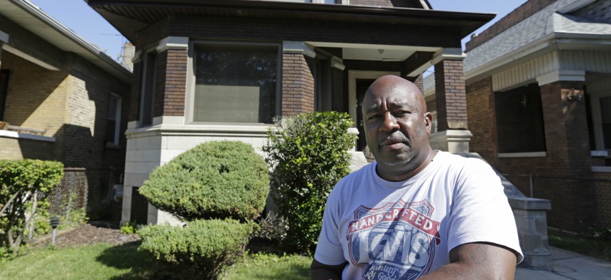Chicago resident James Young stands outside his home in the Auburn Gresham neighborhood in this file photo. A Chicago Tribune report in 2017 found the city’s property tax system placed an unfair burden on poorer residents of minority communities.