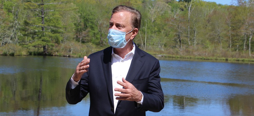 In this May 21, 2020, file photo, Connecticut Gov. Ned Lamont speaks to reporters at Gay City State Park in Hebron, Conn., updating the coronavirus situation in the state. 