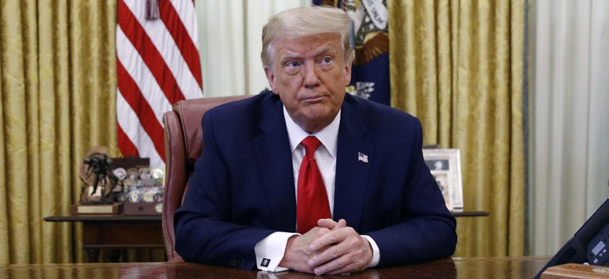 President Donald Trump participates in a law enforcement briefing on the MS-13 gang in the Oval Office of the White House, Wednesday, July 15, 2020, in Washington. 