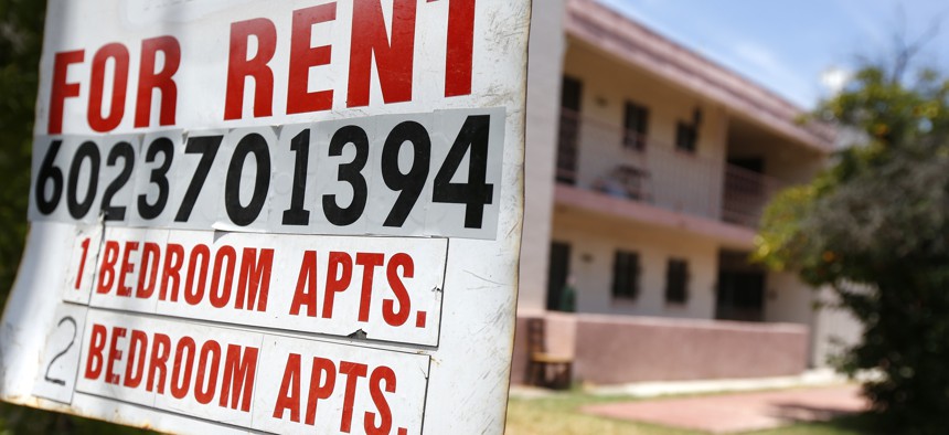 A rental sign is posted in front of an apartment complex Tuesday, July 14, 2020, in Phoenix. 
