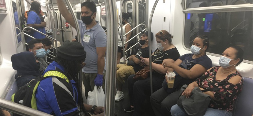 Riders wear masks on a New York City subway train on July 22, 2020.