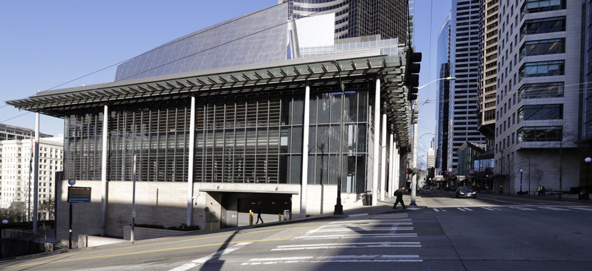 On March 16, 2020, normally bustling streets are nearly deserted adjacent to Seattle City Hall, where workers there and most in the area have been asked to work from home.
